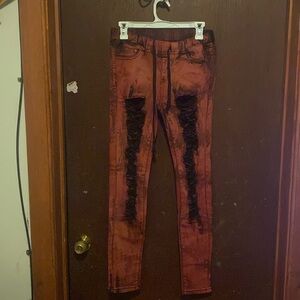 Red and black dyed jeans. Elastic waist. Stretch throughout.